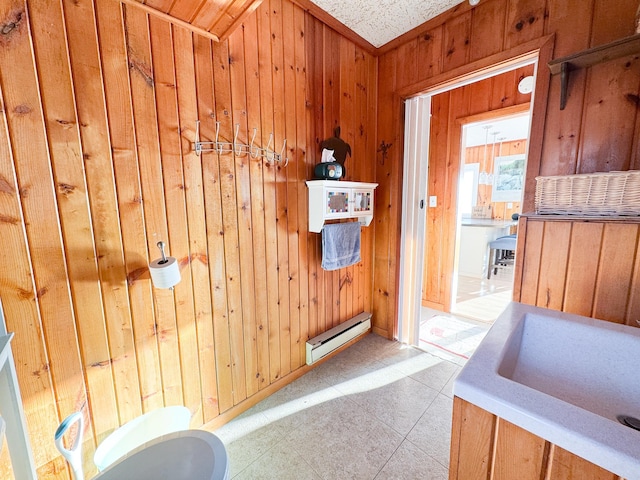 42536 Pleasure Park Rd, Ottertail, MN 56571 - bathroom featuring a baseboard heating unit, wooden walls, and tile patterned floors