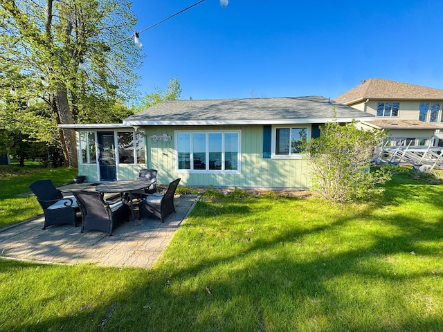42536 Pleasure Park Rd, Ottertail, MN 56571 - back of house with a patio area, a yard, and a sunroom
