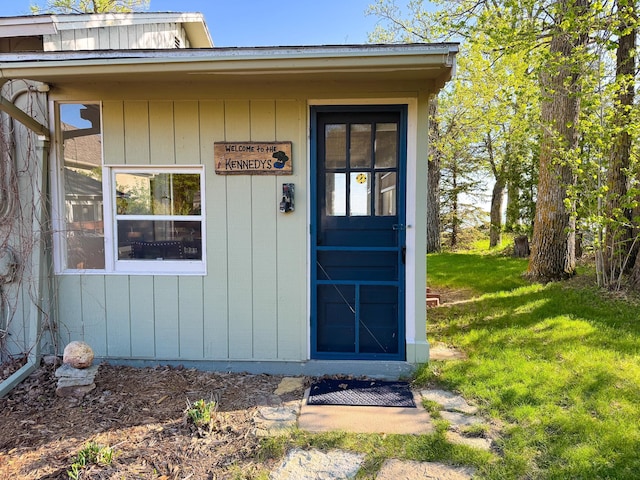 42536 Pleasure Park Rd, Ottertail, MN 56571 - view of exterior entry with a yard