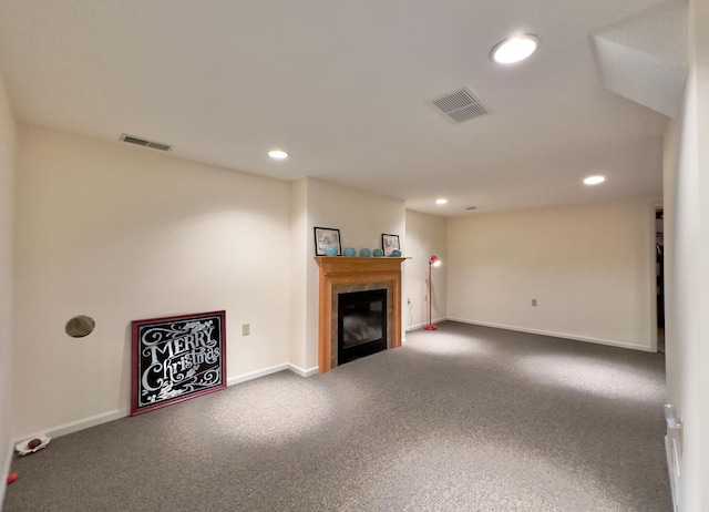 unfurnished living room featuring carpet