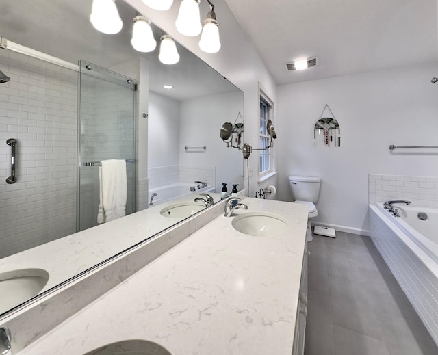 full bathroom featuring tile patterned floors, vanity, toilet, and independent shower and bath