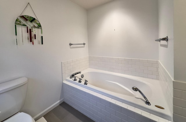 bathroom with a relaxing tiled tub and toilet