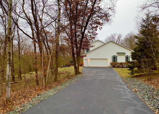 view of property exterior with a garage