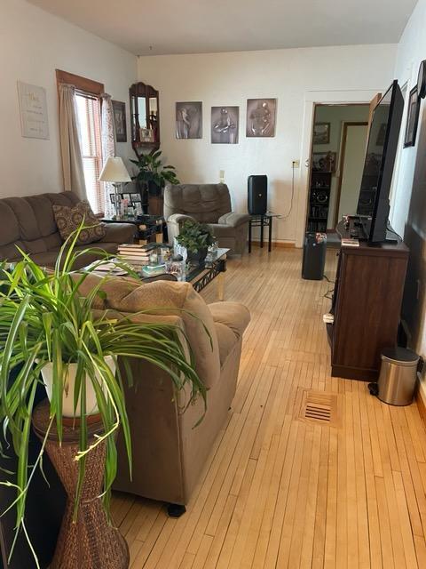 living room with light hardwood / wood-style flooring