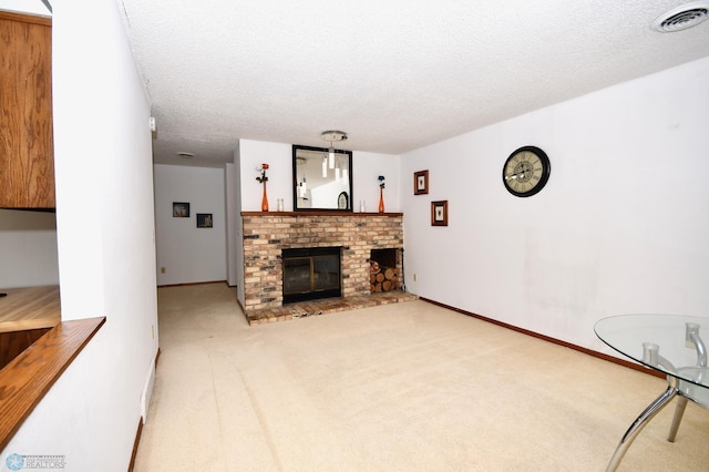 carpeted living room with a textured ceiling and a brick fireplace