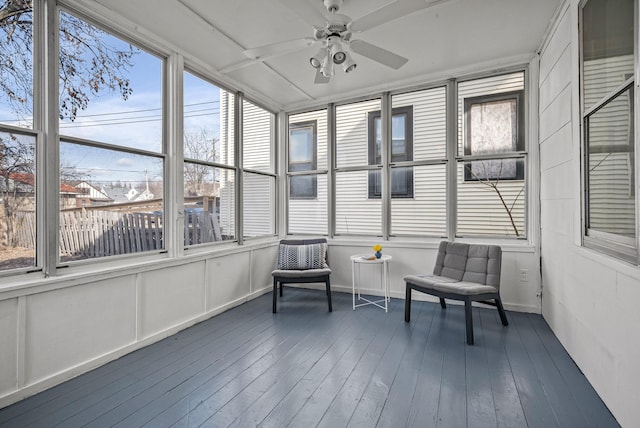 sunroom featuring ceiling fan