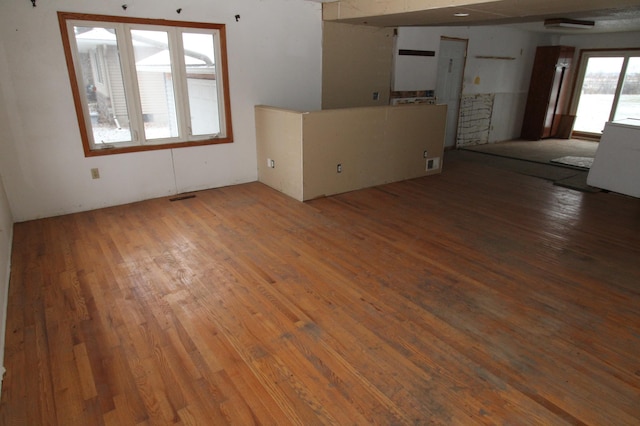 unfurnished living room with hardwood / wood-style floors