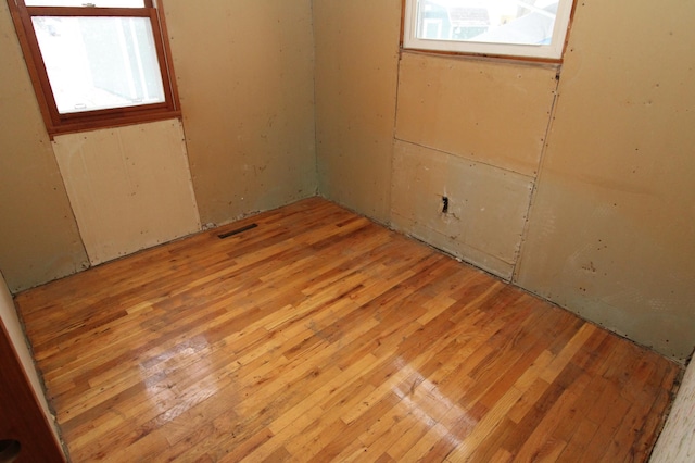 unfurnished room featuring light hardwood / wood-style flooring