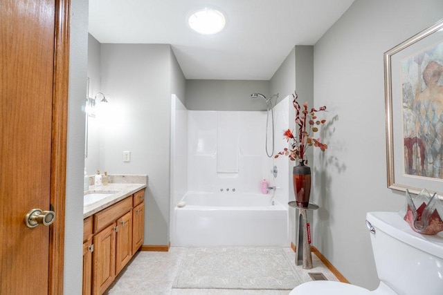 full bathroom featuring tile patterned flooring, vanity, toilet, and  shower combination