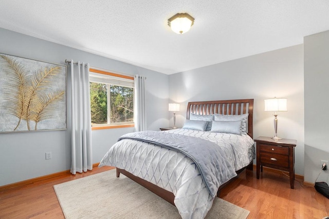 bedroom with light hardwood / wood-style floors