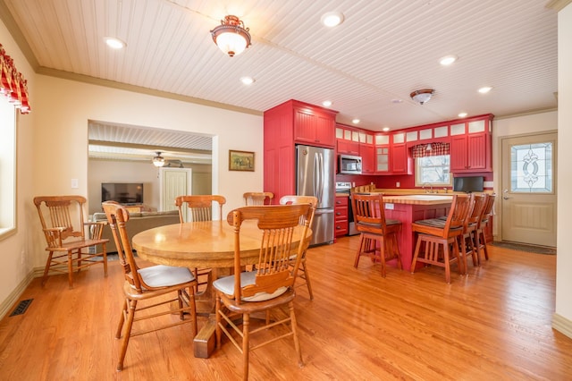 dining space with crown molding, light hardwood / wood-style flooring, and wood ceiling