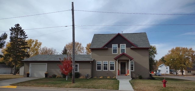 front of property featuring a garage and a front lawn