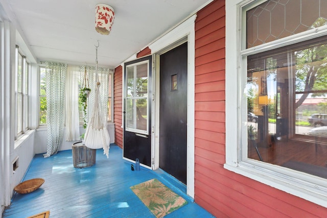 2724 Longfellow Ave, Minneapolis, MN 55407 - unfurnished sunroom with plenty of natural light, hardwood / wood-style flooring, and wooden walls