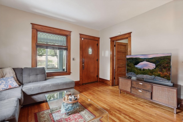 2724 Longfellow Ave, Minneapolis, MN 55407 - living area featuring light wood-style flooring and baseboards