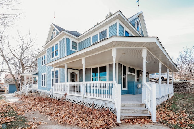 country-style home with covered porch