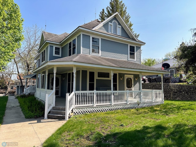 farmhouse-style home with a porch and a front yard