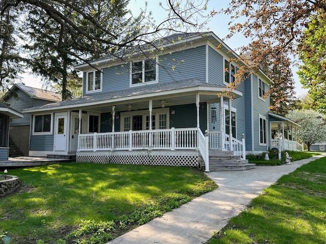 view of front facade featuring a porch and a front lawn