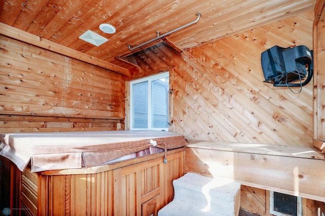 unfurnished bedroom with wooden ceiling and wood walls