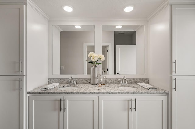 bathroom with vanity and a textured ceiling