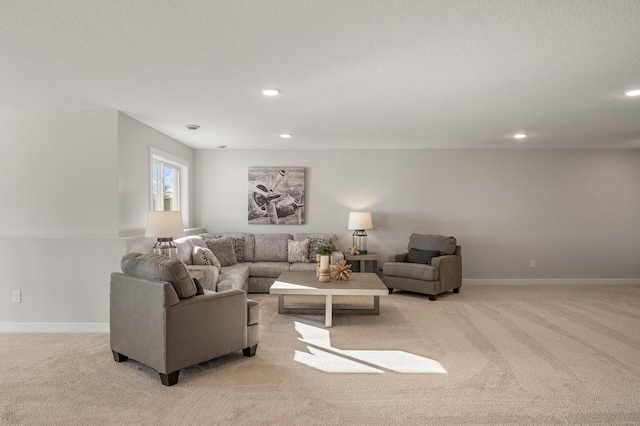 carpeted living room with a textured ceiling