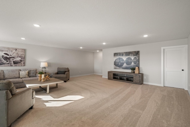 carpeted living room featuring a textured ceiling