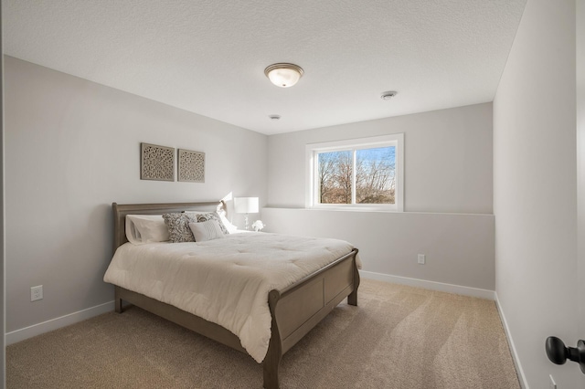 carpeted bedroom with a textured ceiling