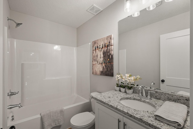 full bathroom with vanity, toilet, shower / bath combination, and a textured ceiling