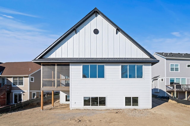 back of house with a sunroom