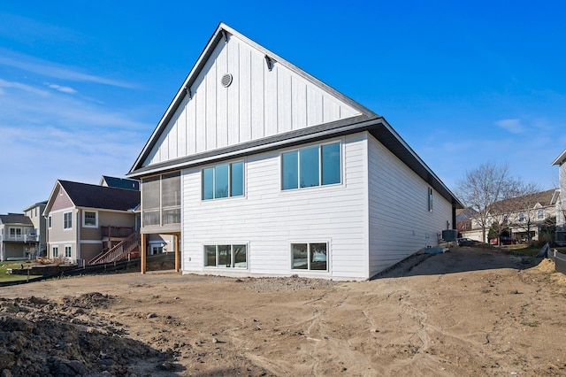 back of house featuring central air condition unit