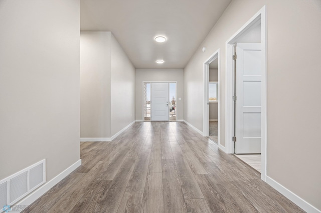 doorway to outside featuring light hardwood / wood-style flooring