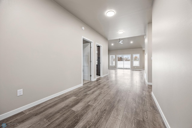 hall with hardwood / wood-style floors