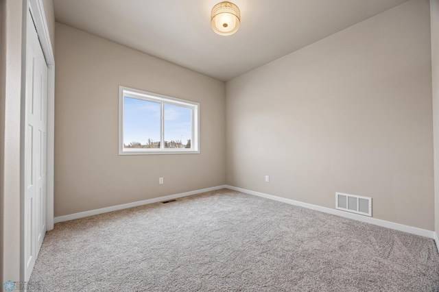 unfurnished bedroom featuring carpet floors and a closet