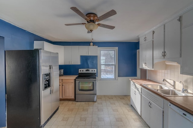 kitchen featuring white cabinets and appliances with stainless steel finishes