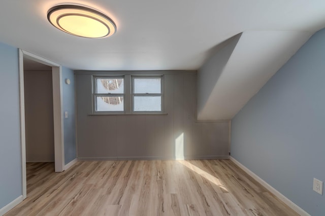 additional living space featuring light wood-type flooring