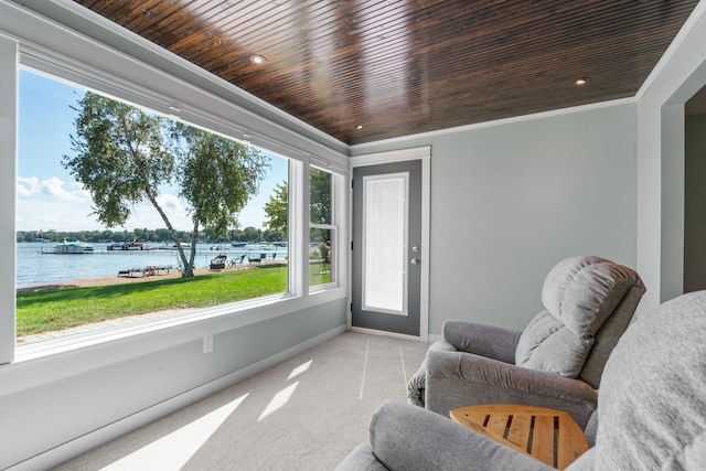 sunroom with a water view and wooden ceiling