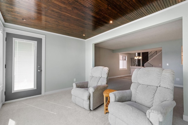 sitting room with light carpet, a notable chandelier, and wood ceiling