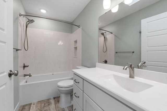 full bathroom featuring vanity,  shower combination, toilet, and wood-type flooring