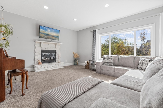 living room with a fireplace and carpet flooring