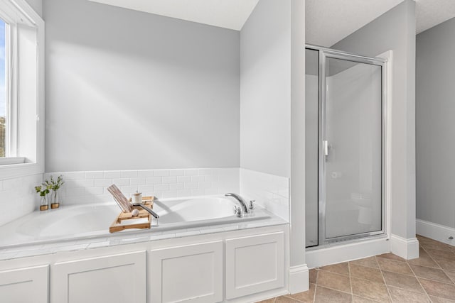 bathroom with plus walk in shower and tile patterned floors