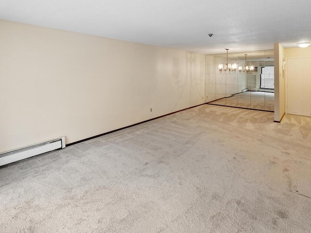 spare room with light colored carpet and a notable chandelier