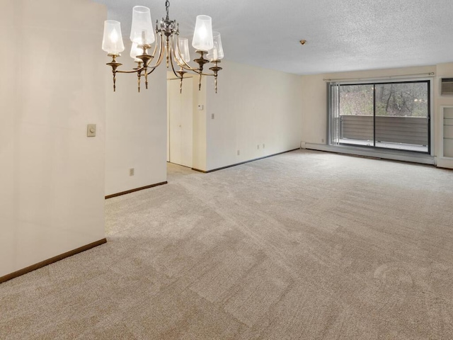 unfurnished room with light carpet, a baseboard heating unit, and a notable chandelier