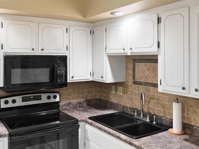 kitchen with decorative backsplash, white cabinetry, stainless steel range with electric stovetop, and sink