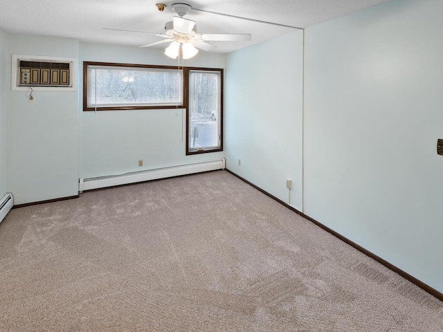 unfurnished room with ceiling fan, light colored carpet, and a baseboard radiator