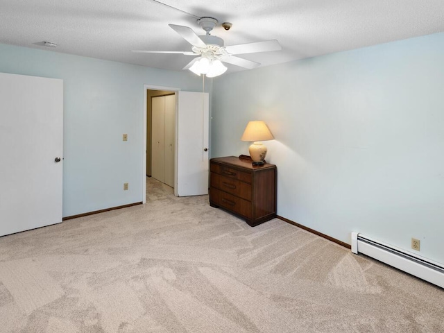 bedroom with light carpet, a baseboard radiator, and ceiling fan