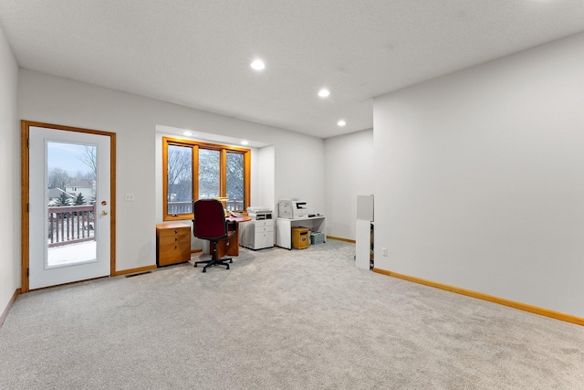 carpeted office space featuring recessed lighting and baseboards