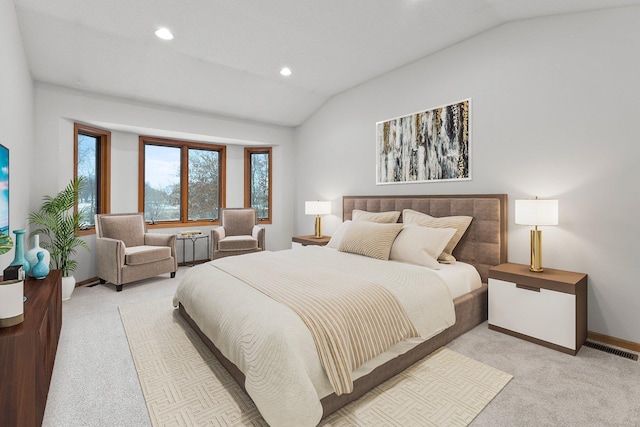 bedroom featuring vaulted ceiling and light carpet