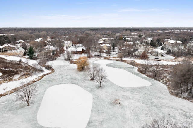 snowy aerial view featuring a residential view