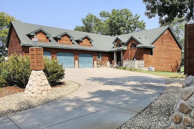 view of front of house featuring an attached garage and driveway