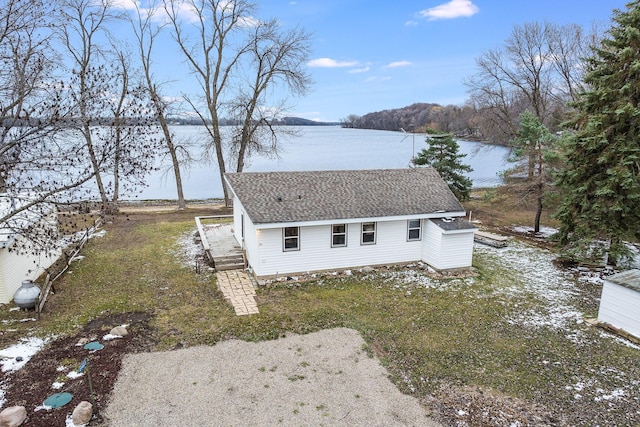 view of front of property with a water view