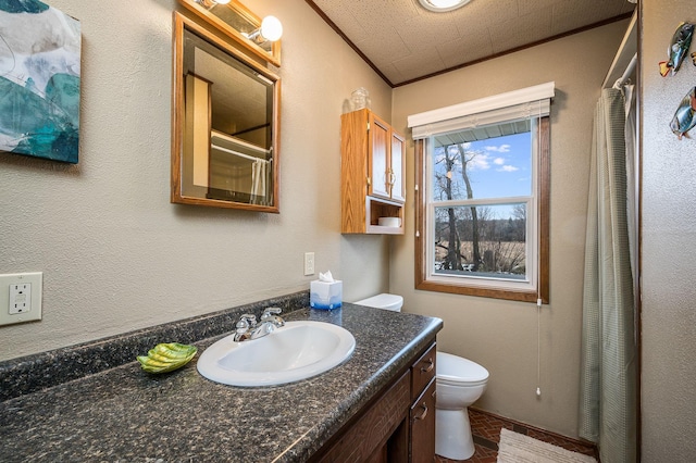 bathroom with a textured ceiling, vanity, toilet, and a shower with curtain